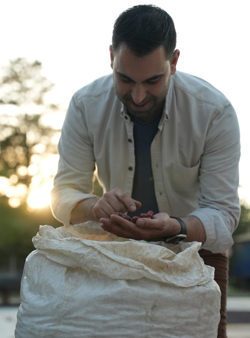 Hovik Azadkhanian, CEO of Heirloom Coffee Roasters inspecting coffee beans